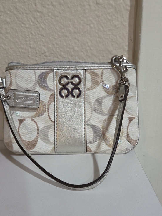 Coach Handbags - Coach Ivory Signature Wristlet with Silver Accents